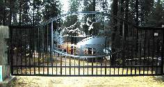 Ornamental Gate with heavy top rail with mountains and a boat